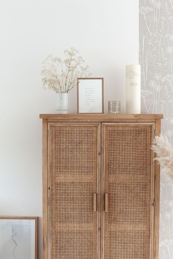 Styled Wicker Cabinet Caned Doors - May Pinterest: Top 15 Pins: A beautiful wooden rustic cabinet furniture piece with caned doors styled with white decor on top of the cabinet. @chloedominik #caneddoorcabinet #canedfurniture #canedfurnituredecor