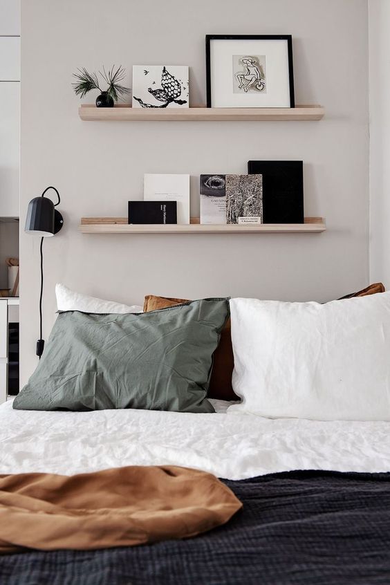 Picture ledge display wall a space saving trick for a smaller bedroom