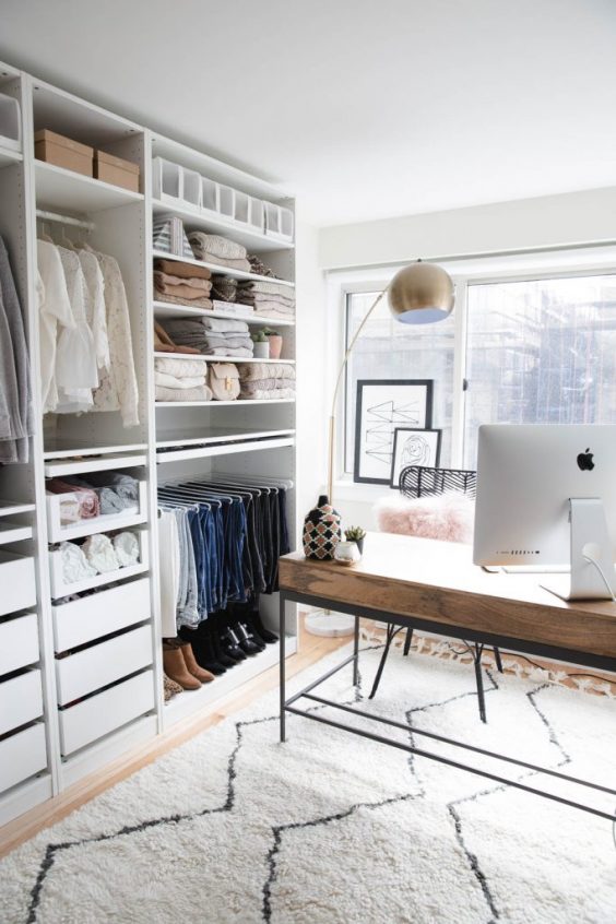 Home Office And Organized Closet Space - 16 Amazing Stylish Wardrobe Ideas That Use The Ikea Pax: Even if you have to combine two spaces into one room it can look just as great like this home office setup with a tidy and organized open Ikea Pax closet system. making the most out of one room. @chloedominik #homeofficeandcloset #homeofficeandclosetcombo #homeofficeandclosetroom #ikeapaxcloset #ikeapaxideas #opencloset #openclosetideas