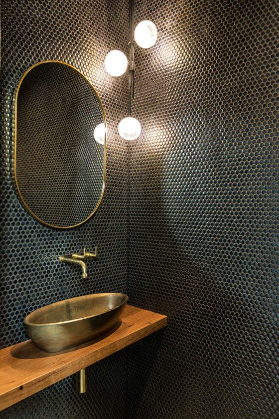Black & Gold Powder Room - September Pinterest 2020: Top 15 Inspiration & Ideas: An elegant black powder room tiled in small black circle tiles fitted with a modern corner pendant light and gold finished for the taps hardware, mirror and vessel sink. @chloedominik #powderroom #powderroomideas #blackandgoldpowderroom #blackpowderroom