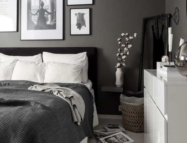 Dark Grey Modern Bedroom - 6 Tips To Refresh Your Bedroom Without Doing A Full Makeover: Beautiful calming bedroom with a focal wall painted dark grey with stylish black framed gallery wall above the headboard. Decorated minimal with neutral colours to compliment the black, white and gray color scheme. #modernbedroom #modernbedroominterior #modernbedroomdecor #darkgreybedroom #moderndarkgreybedroom #calmingbedroom #neutralbedroomideas #gallerywallbedroom