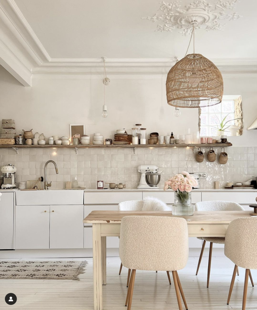No Upper Cabinet Kitchens:
Beautiful neutral cream kitchen with wooden bracket shelf above cream glazed tiled backsplash. 
Photo credit: Carole from Greenpatchouly Instagram profile. 